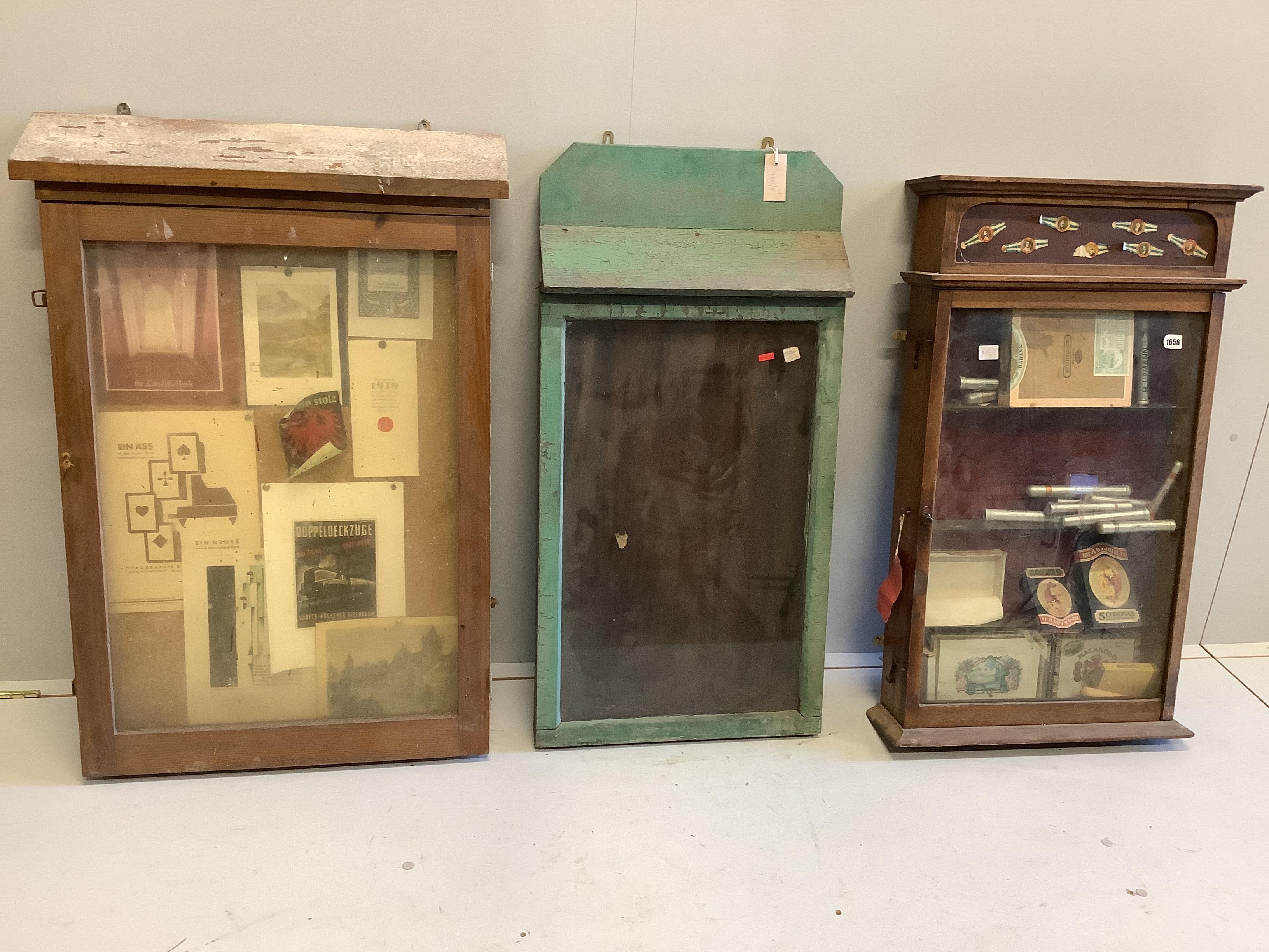 Three glazed wood wall display cabinets, largest height 97cm